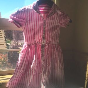 Pink striped polo dress for children.